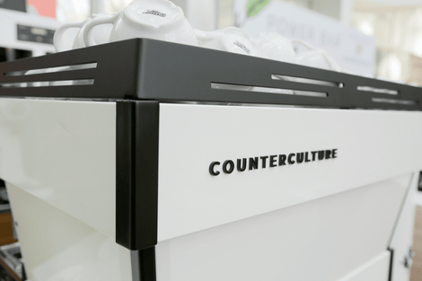 Photo of an espresso machine that is branded and says "Counter Culture."