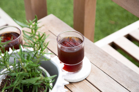 Photo of cold coffee on a wooden surface.