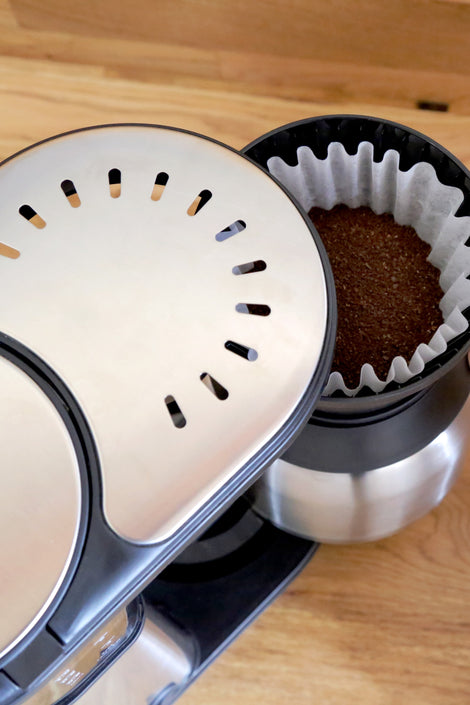 Photo of coffee grounds in a coffee machine. 