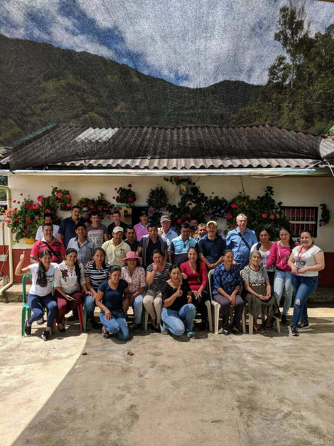Group of La Esmeralda Association members together smiling for a photo.